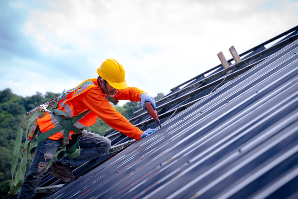 tech installing mega-rib roof panels